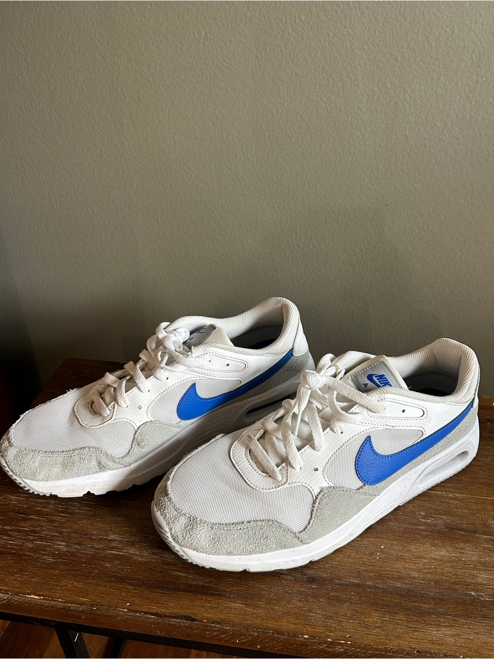 Nike Air Men's White Sneakers with Blue Swoosh Accent